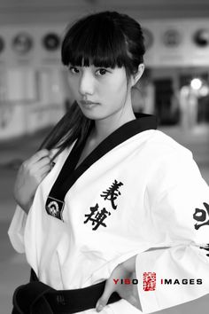 a woman in a kimono poses for a photo