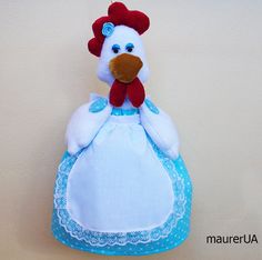 a stuffed chicken wearing a blue dress