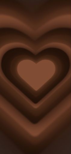 a heart shaped object in the middle of some chocolate swirls