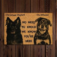 the german shepherd door mat has two dogs on it