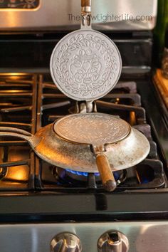 an old frying pan is sitting on the burner of a stove top oven