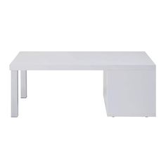 a white table sitting on top of a white floor