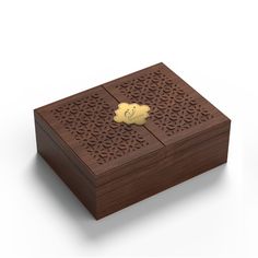 a wooden box with a gold emblem on it