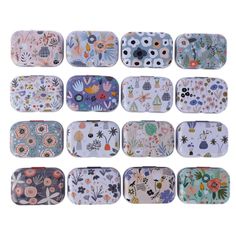 nine rectangular trays with various designs on them, each decorated in different colors and sizes