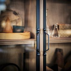 an image of a kitchen cupboard with glass doors