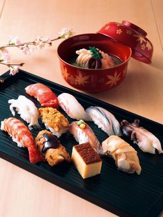 there are many different types of sushi on the tray