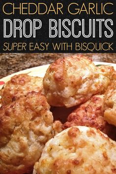 some biscuits are sitting on a plate with the words, cheddar garlic drop biscuits super easy with biscuits