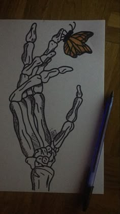 a drawing of a hand holding a butterfly