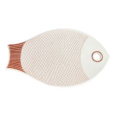 a white and red fish shaped dish on a white surface