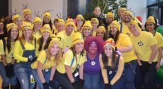 a group of people in costumes posing for a photo