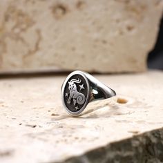 This Zodiac signet ring features a sea-goat on a black background with three twinkling stars. Birthdates - 22nd December - 20th January Element - Earth Capricorn is the tenth sign of the Zodiac and is symbolised the mythical sea-goat. A creature with the forepart of a goat and the tail of a fish.  Characteristics of this star sign include generosity, a strong desire for success and an ability to outlast their problems and overcome limitations.  Solid Sterling Silver Ring Face - 15x11mm Height of Zodiac Jewellery, Sea Goat, Burning Rose, Oval Signet Ring, Rose Jewellery, Element Earth, Twinkling Stars, A Goat, Zodiac Jewelry