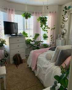 a bedroom with lots of plants in it