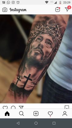 a man's arm with a tattoo of jesus on it and the words instagram