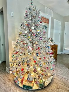 a white christmas tree with lots of ornaments