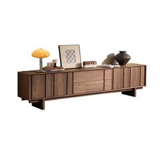 the sideboard is made out of wood and has two lamps on it