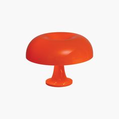 an orange mushroom shaped object on a white background