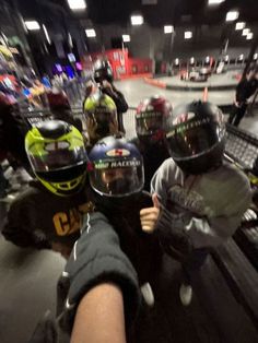 a group of people wearing helmets in a parking garage