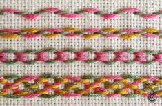 two rows of different colored stitchs on a white cloth with pink, yellow and green thread