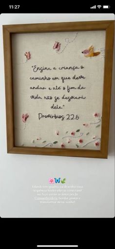 a cross stitch frame with a quote on it