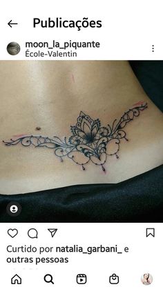 a tattoo on the back of a woman's stomach