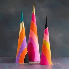 three different colored cones are on the table