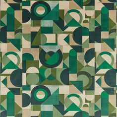 an abstract rug with green and beige shapes