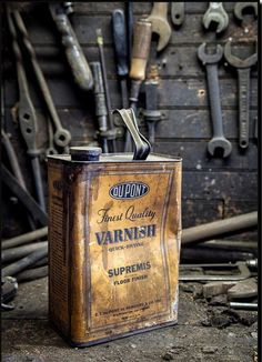 an old tin can with some tools in it