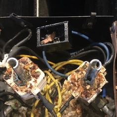 the inside of an electrical box filled with wires