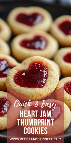 heart - shaped jam thumb cookies on a plate with text overlay