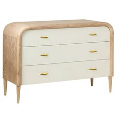 a white and wood dresser with gold handles