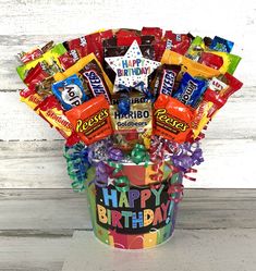 a birthday bucket filled with candy and candies