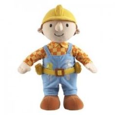 a small stuffed toy wearing overalls and a hard hat