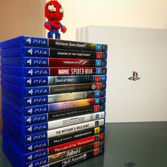 a stack of video games sitting on top of a table