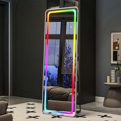 a colorful mirror sitting in the middle of a living room