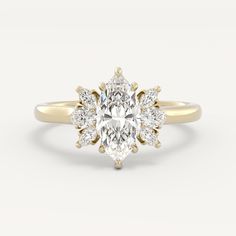 a yellow gold ring with an oval cut diamond surrounded by smaller round diamonds on the band