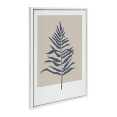 a framed print with a blue leaf on it's back and white frame, hanging on the wall