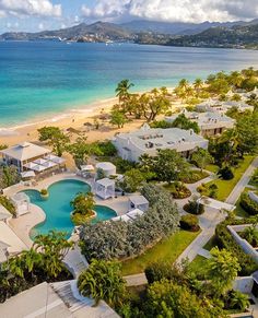 an aerial view of a beach resort and pool