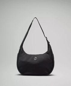 The lululemon mini shoulder bag is rarely in stock, but right now, you can scoop it up in *two* colors (black and green). Here's everything you need to know about the sporty chic purse, which has racked up more than 4 million views on TikTok. Chic Purses, Running In Cold Weather, Mini Shoulder Bag, Day Bag, Back In Stock, Body Fit, Belt Bag