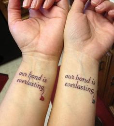 two people with matching tattoos on their arms, one is saying love and the other is saying