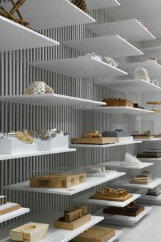 the shelves are filled with different types of objects and materials in varying shapes, sizes, and colors