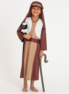 a little boy dressed up as a shepherd with a sheep and an umbrella in his hand