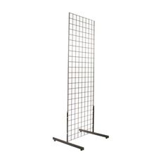 a large metal grid with two legs on each side and one leg up against the wall