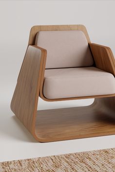 a wooden chair with beige upholstered seat and back rest on top of a rug