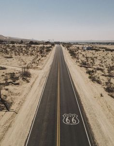 an aerial view of a highway with the route 66 painted on it's side