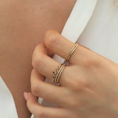 a close up of a person wearing two rings