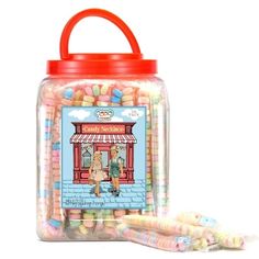 a jar filled with lots of candy sitting on top of a table