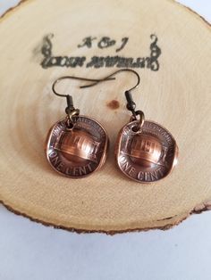 Genuine U.S. Copper Pennies designed into cowboy or cowgirl hat earrings. A 1959 and a 1982  penny was chosen for this set. I buff them to bring out  the design on the pennies I put antique patina I domed and polish also apply a clear metal coating to the pennies  to maintain the color end shine. CHAIN NOT INCLUDED Copper Pennies, Penny Jewelry, Custom Coins, Cowgirl Hat, Coin Earrings, Cowboy Cowgirl, Cowgirl Hats, Coin Jewelry, Earrings Unique