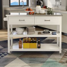 a white kitchen island with lots of bottles on it