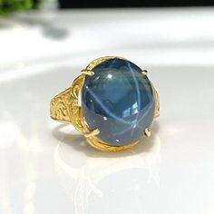 Antique Vintage 22K Solid Gold 6.85ct Natural Dark Blue Star Sapphire Carved Ring....Marked inside the band 22k...Total of weights 4.6grams... Size 6.5...Measure of Oval Star Sapphire 13.5 x 11.5MM....It's in very good vintage condition. Luxury Blue Cabochon Sapphire Ring, Luxury Heirloom Yellow Gold Sapphire Ring, Wizard Jewelry, Blue Star Sapphire Ring, Star Sapphire Ring, Pretty Accessories, Blue Star Sapphire, Carved Ring, Star Sapphire