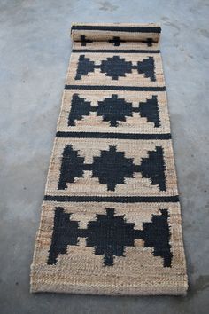 a black and white rug on the ground